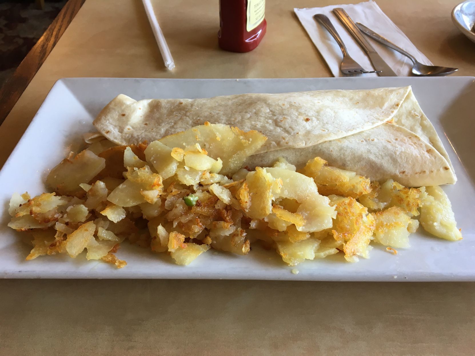 Breakfast burrito and hash browns